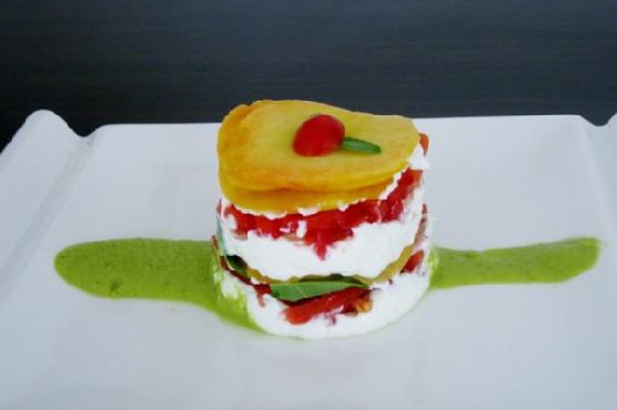 Peaches, tomatoes, and goat cheese layer cake with a peach-basil sauce Peaches, tomatoes, and goat cheese layer cake with a peach-basil sauce