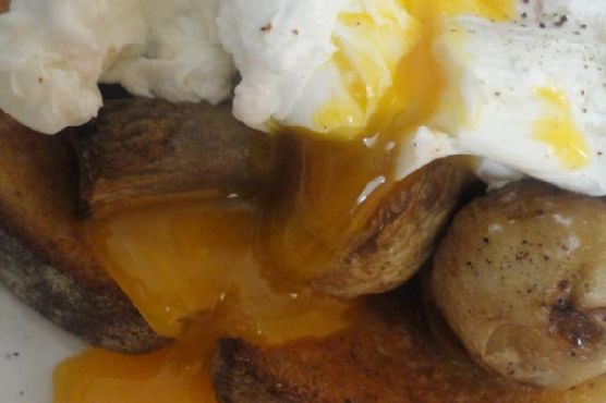 Poached Eggs On A Bed Of Fried Mushrooms and Country White Bread
