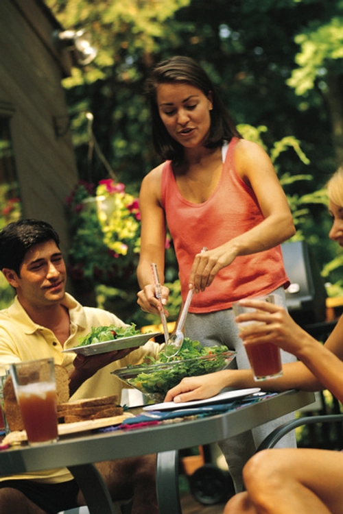 Woman Happy Serving Dinner